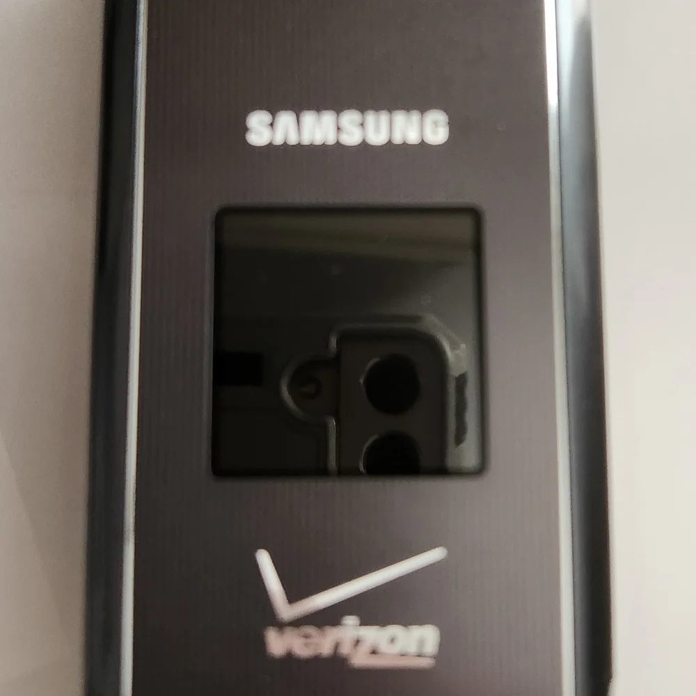 Verizon Flip Phone with Silver and Black Design